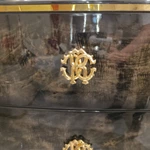Curved Black and Cream Sideboard Cabinet with Three Central Drawers Textured Side Panels Gold Monogram Pulls and Rounded Profile